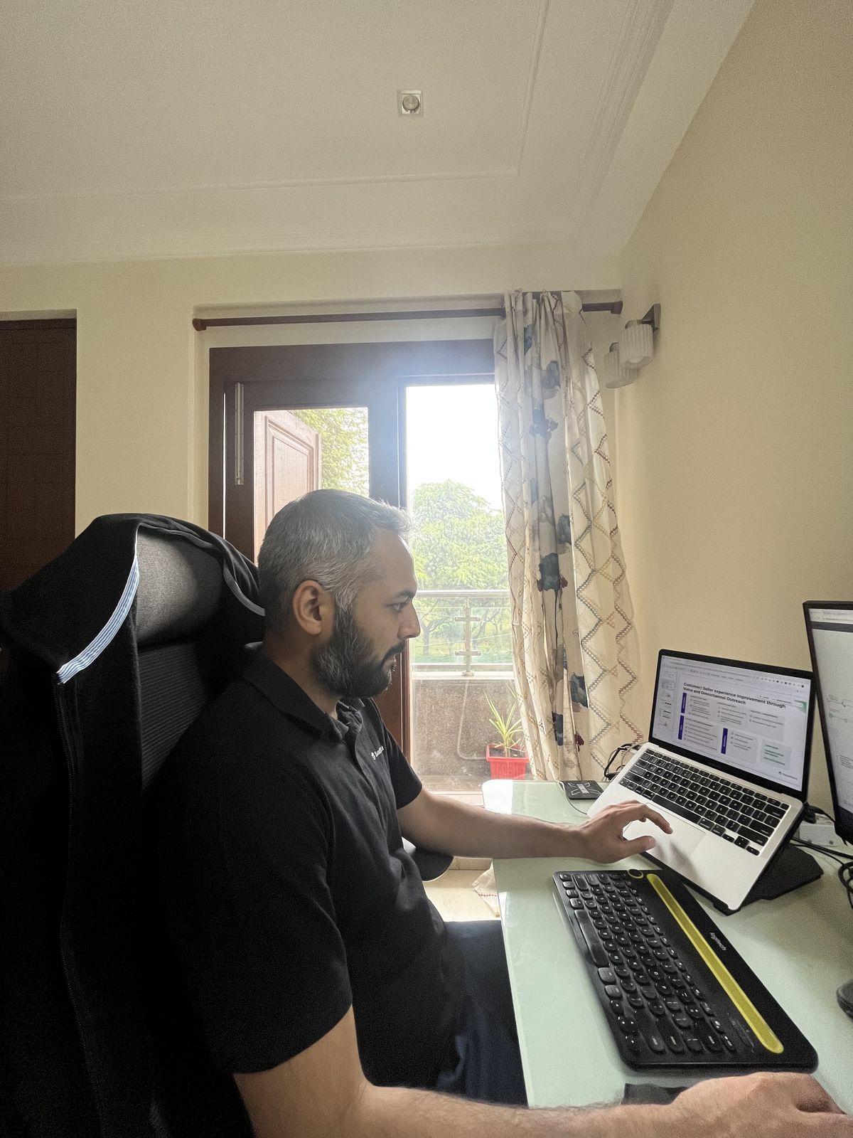 Rishabh Ladha at his desk, working on a sales deck